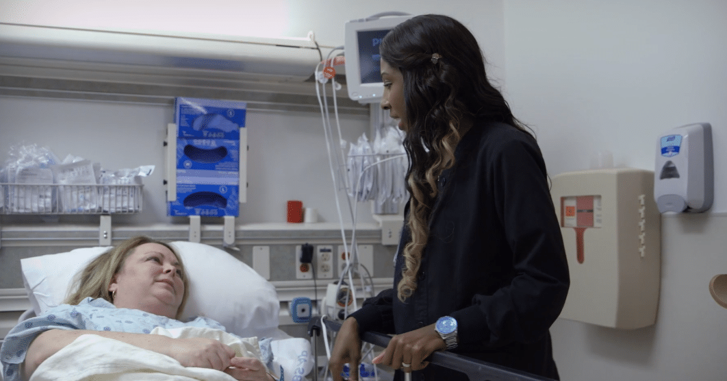 Nurse KeV’ann Jarman speaks with a patient.