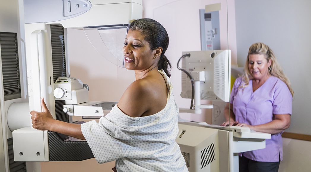 African-American woman getting a mammogram African-American woman getting a mammogram