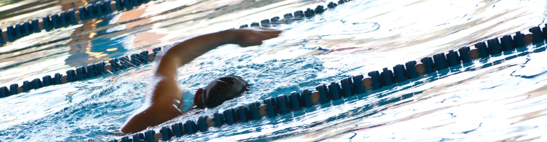 A person swims during an exercise class.