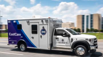 An ECU Health EastCare ambulance drives down the road.