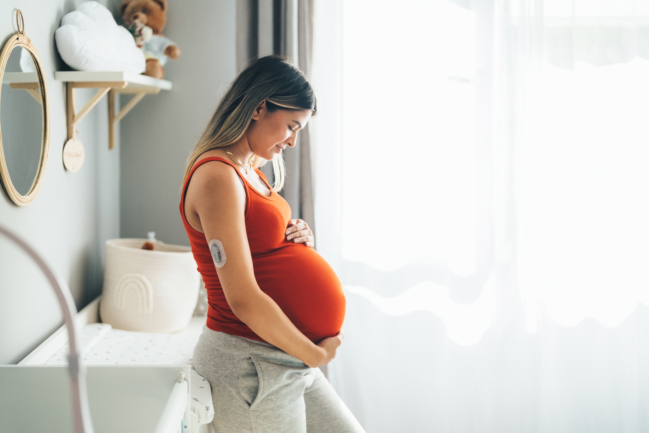 Pregnant young woman with diabetes at home feeling excited about her firstborn Young woman with diabetes enjoying the last month of her pregnancy