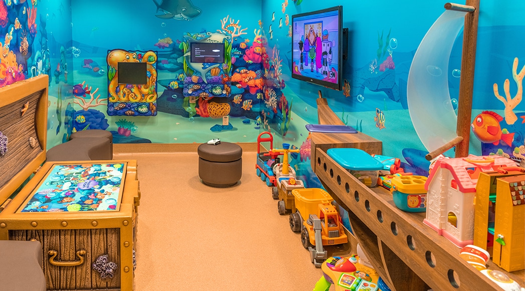 The child-friendly environment includes a dedicated playroom to reduce fear preoperatively.