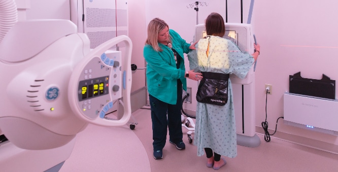 A pediatric patient gets ready during a radiological appointment.