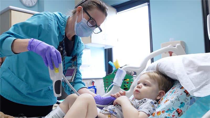 a PICU team member treats a pediatric patient at Maynard Children's Hospital.