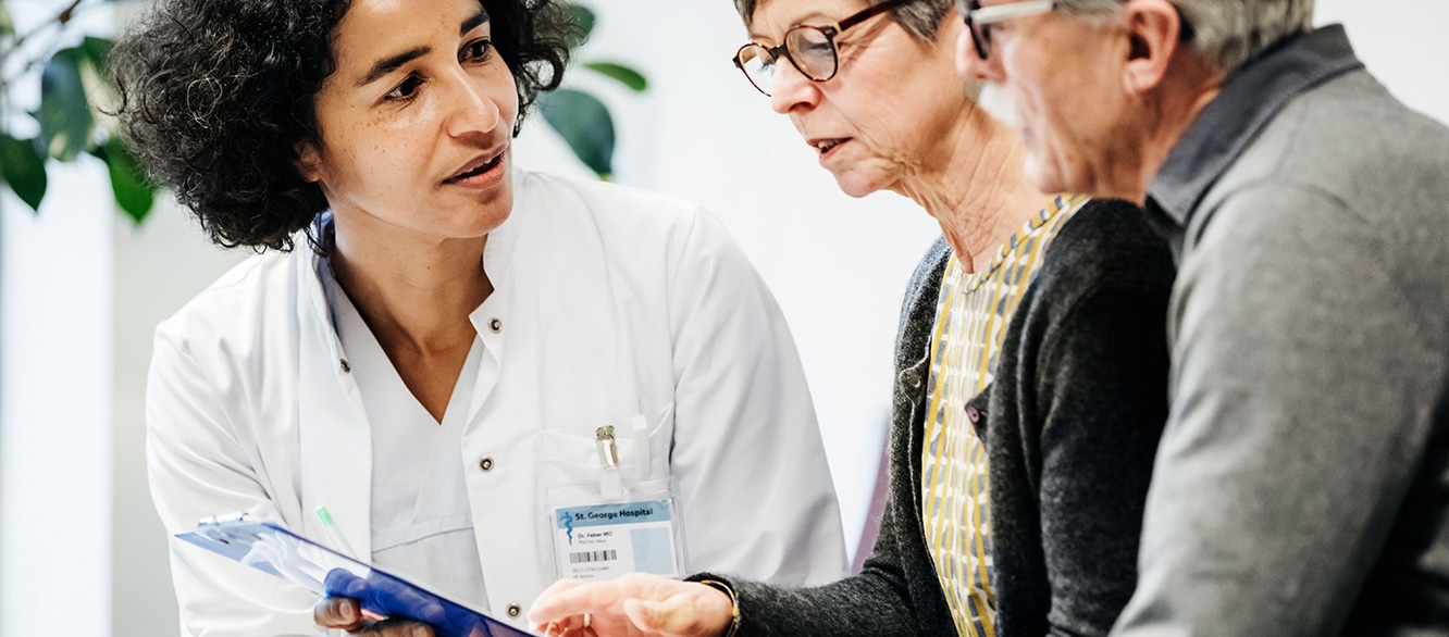 Clinical Doctor Giving Test Results To Patients