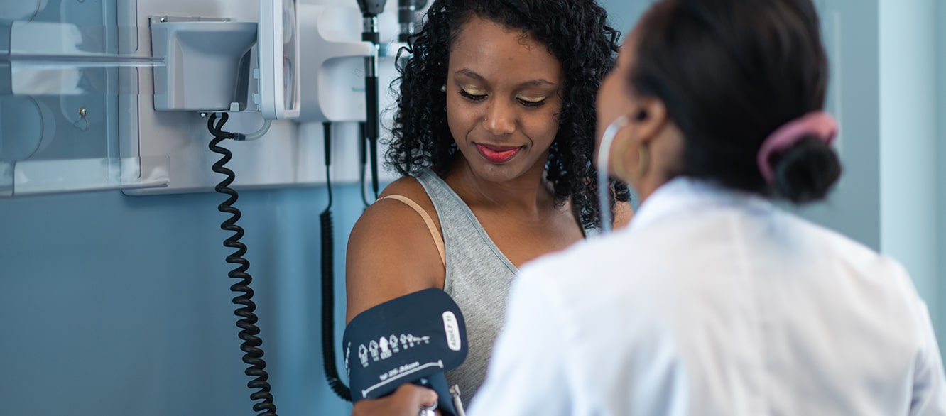 Young woman in medical consultation with female doctor