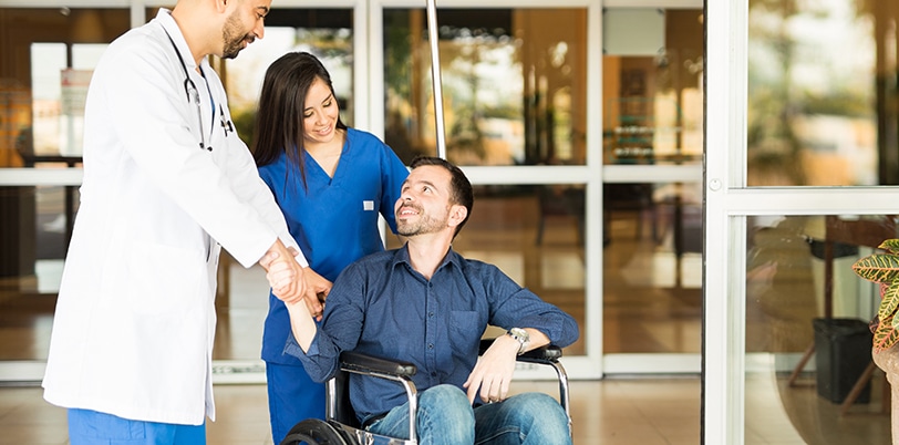 Patient leaving the hospital on a wheelchair