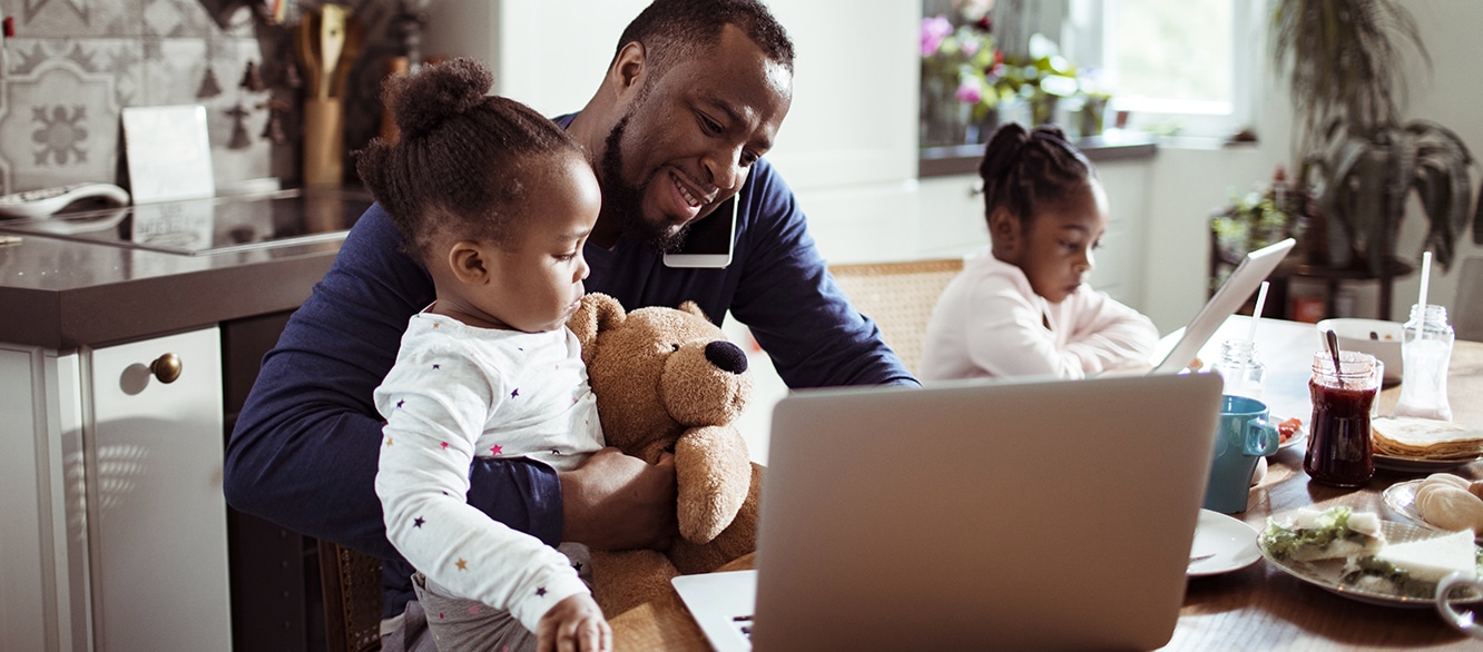 Young Family using a Laptop during Breakfast