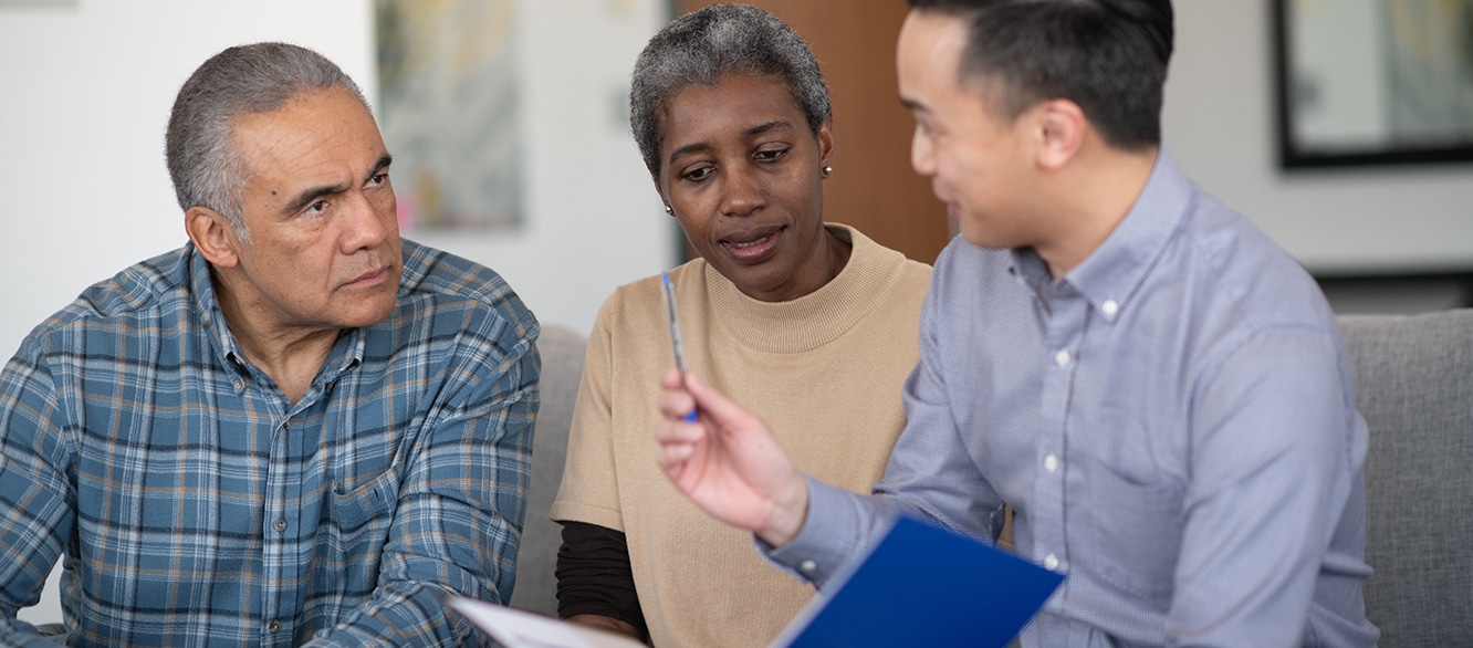 An Elderly African American Couple Meet With Their Adviser stock photo