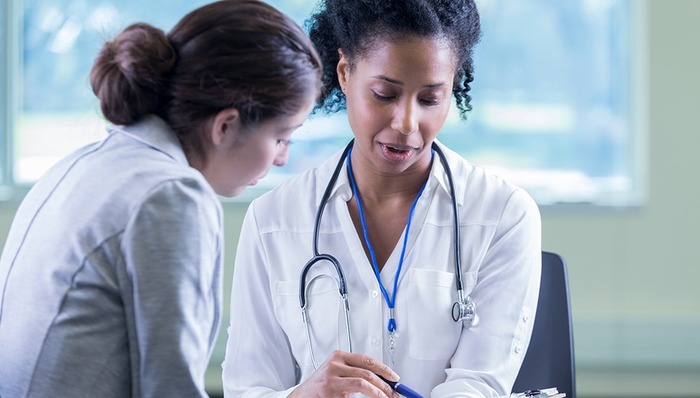 Doctor reviews a patient's medical information