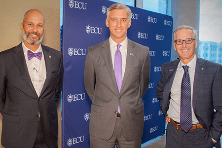 Dr. Michael Waldrum stands with ECU Chancellor Philip Rogers and Dr. Jason Higginson.