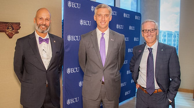 ECU Health Chief Health Officer Dr. Jason Higginson poses for a photo with ECU Chancellor Philip Rogers and ECU Health CEO Dr. Michael Waldrum.