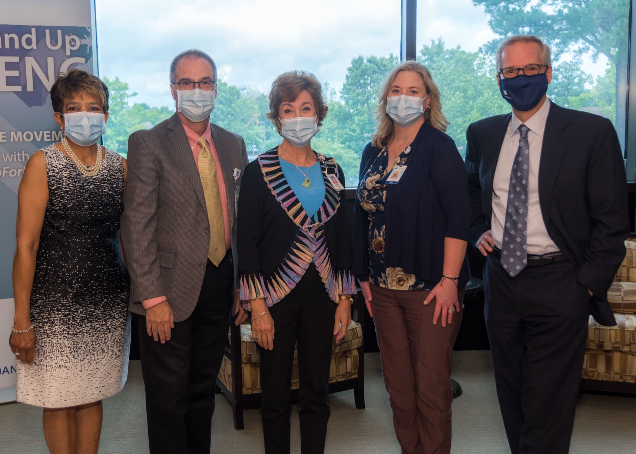 Vidant Edgecombe Hospital leaders pose for a photo with Dr. Michael Waldrum