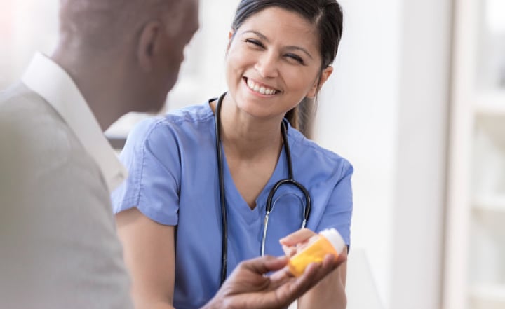 A provider discusses a prescription with a patient.