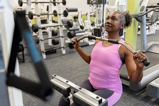 A woman exercises at ECU Health Wellness Center.