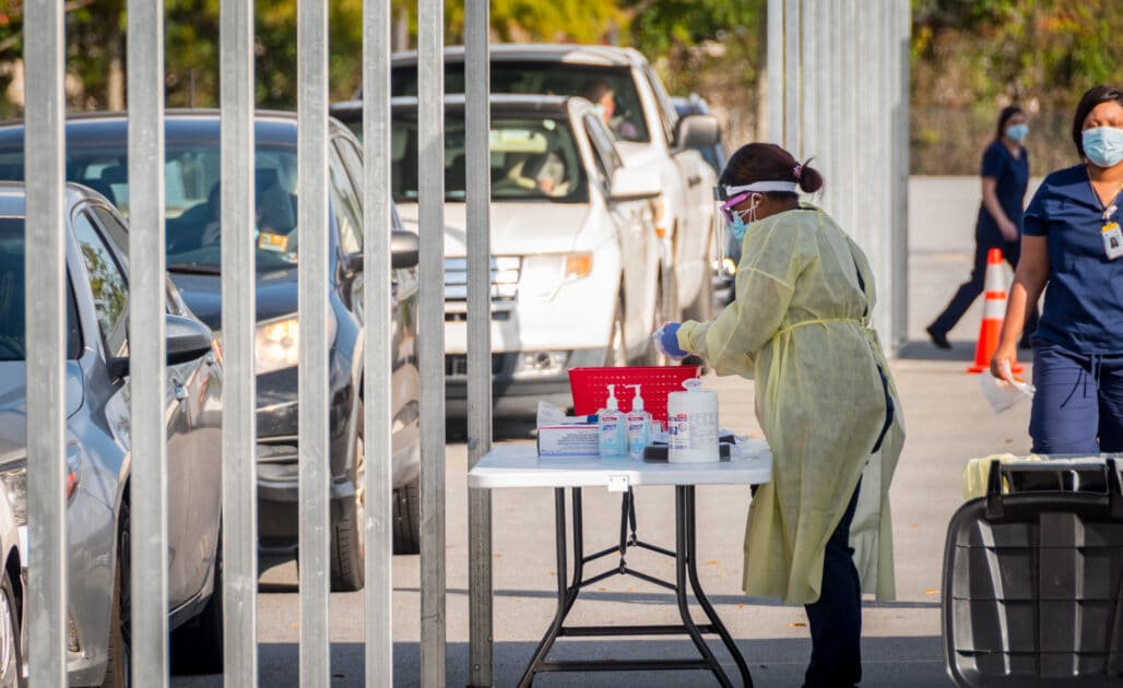 A team member administers COVID-19 tests.