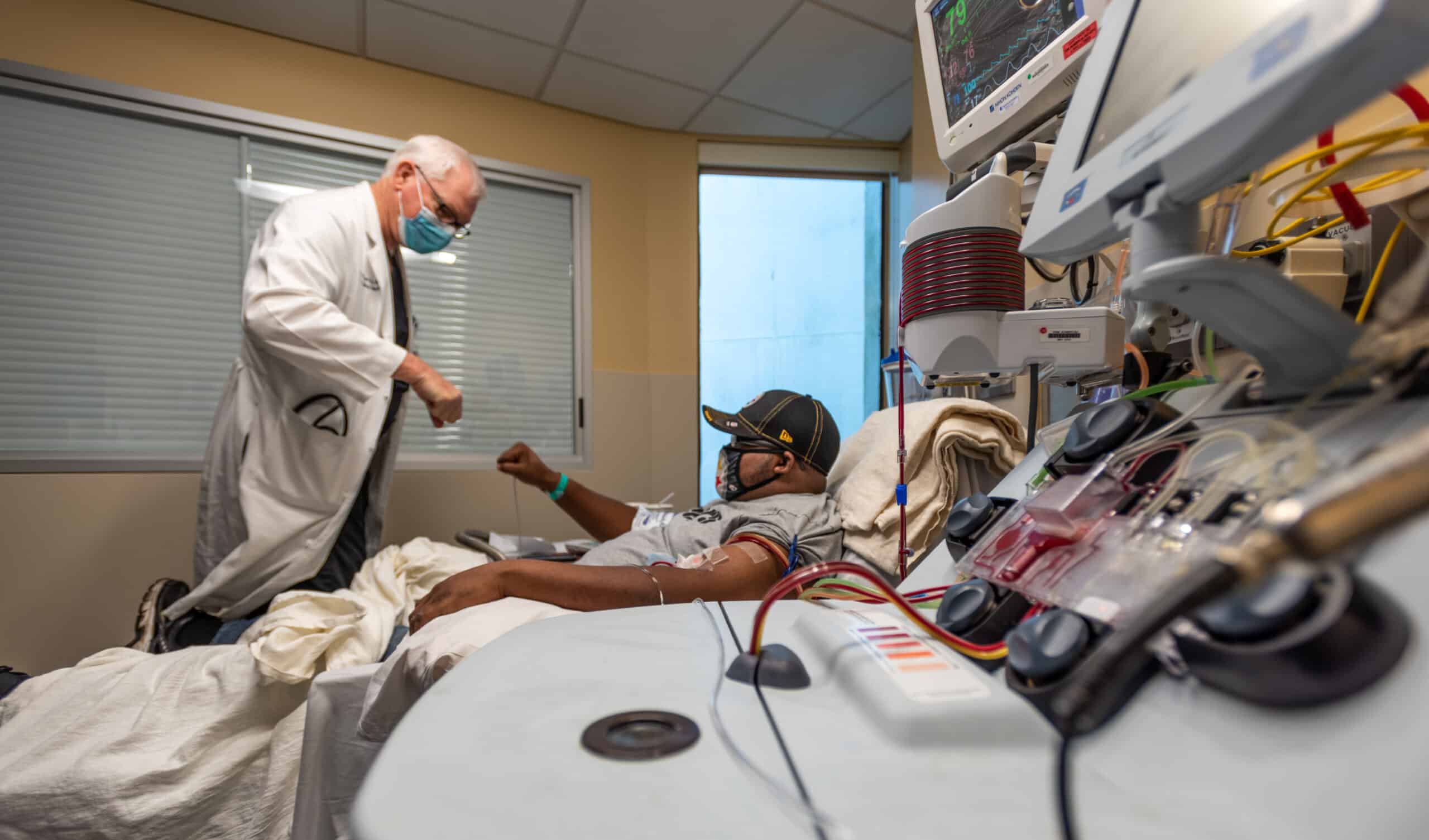 A provider interacts with a patient at the renovated Renal Dialysis Unit at ECU Health Medical Center.