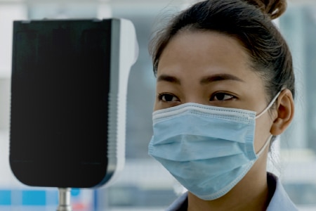 A woman is checked into the hospital as a visitor.