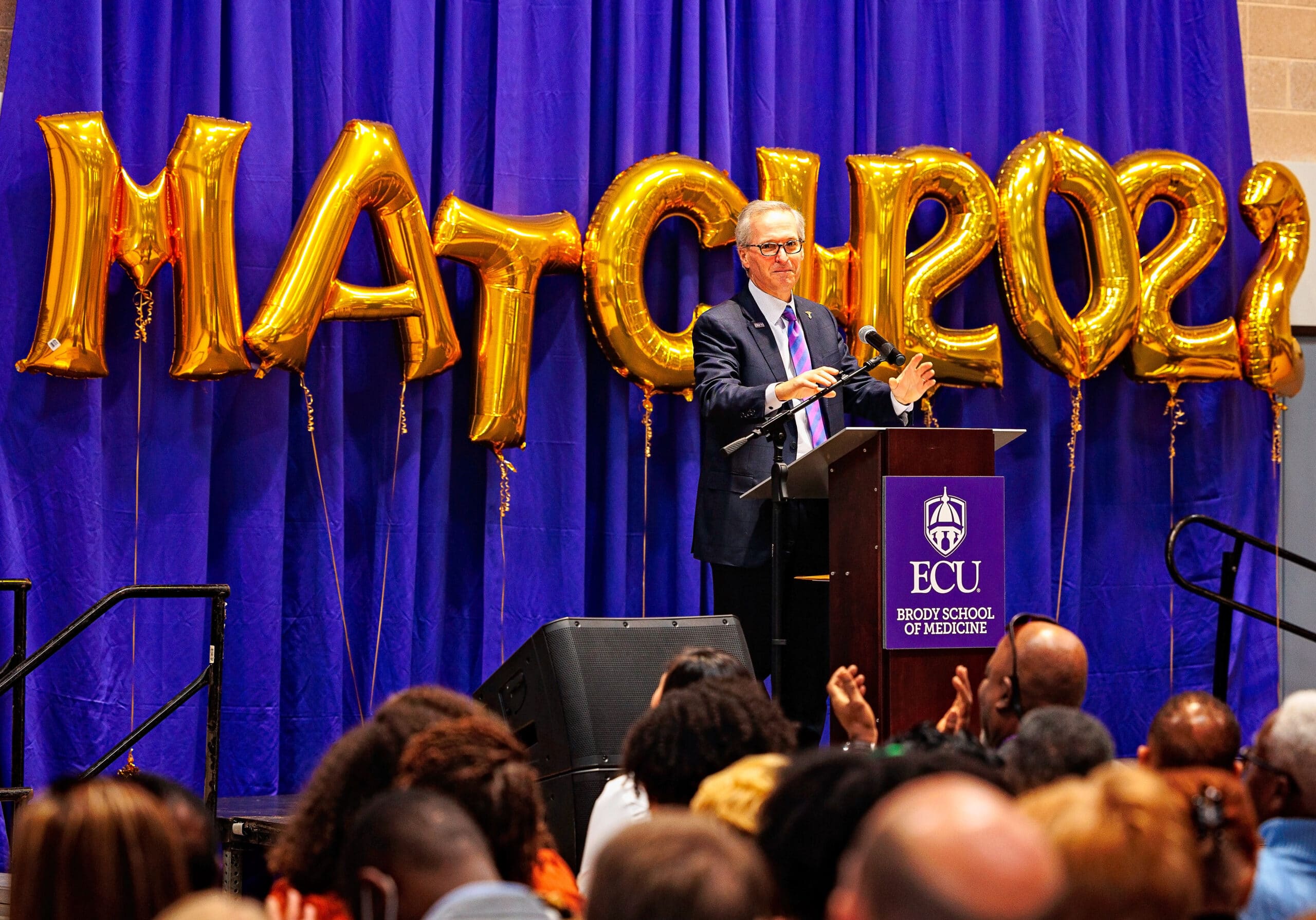 Dr. Michael Waldrum, chief executive officer of ECU Health and dean of the Brody School of Medicine at East Carolina University, speaks during Match Day on March 18, 2022.