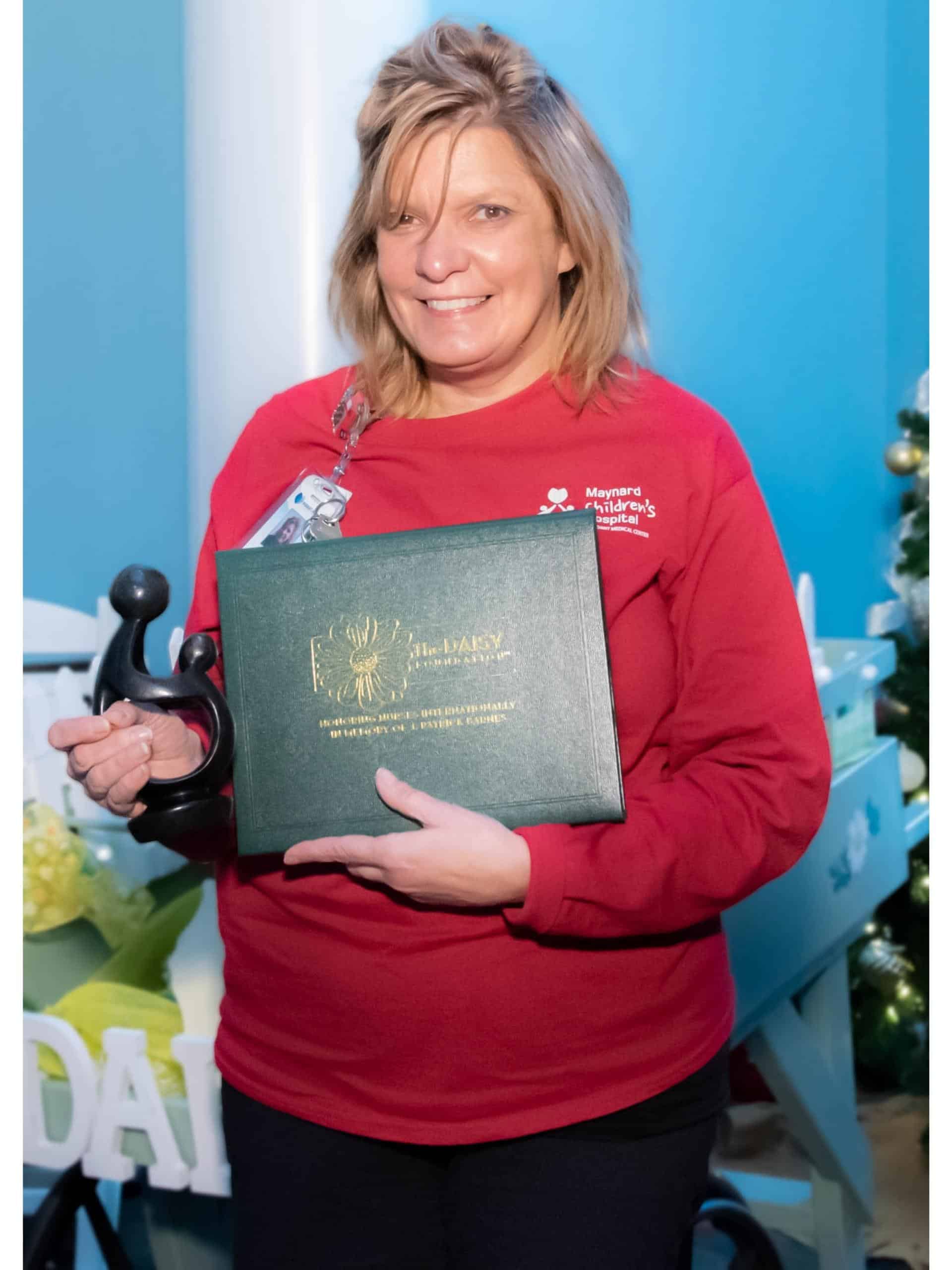 Deb Pomeroy receives a daisy award