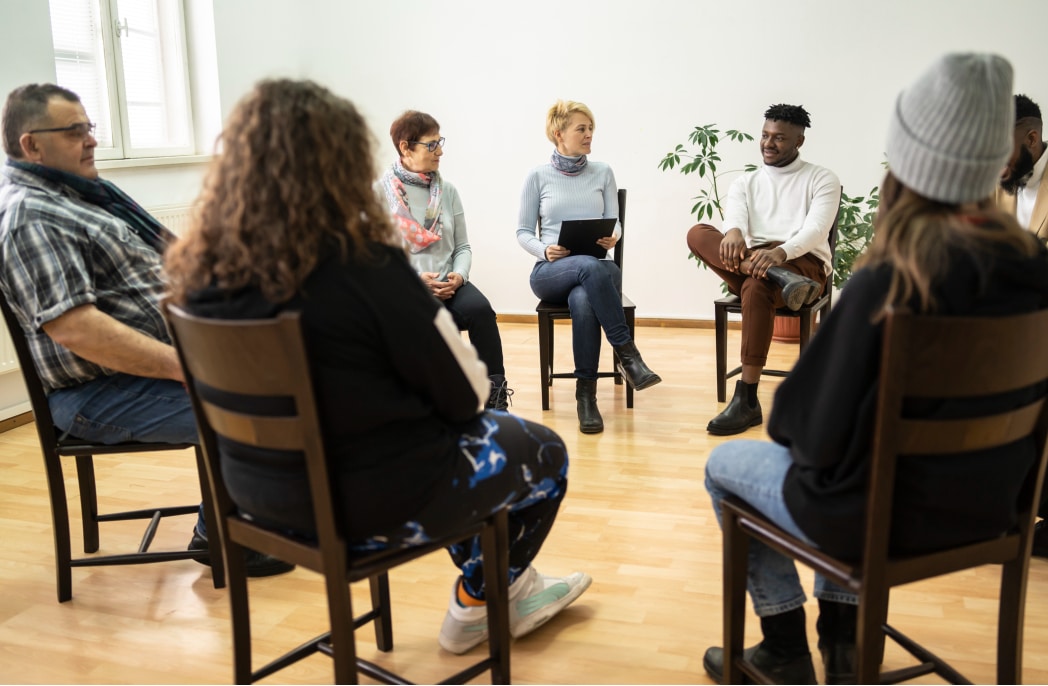 A support group meets to discuss.