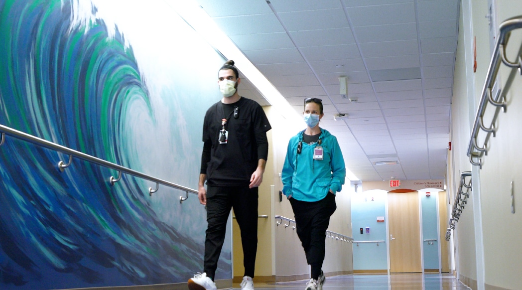 ECU Health team members pass the Wave Wall in the PICU at the Maynard Children's Hospital at ECU Health Medical Center.