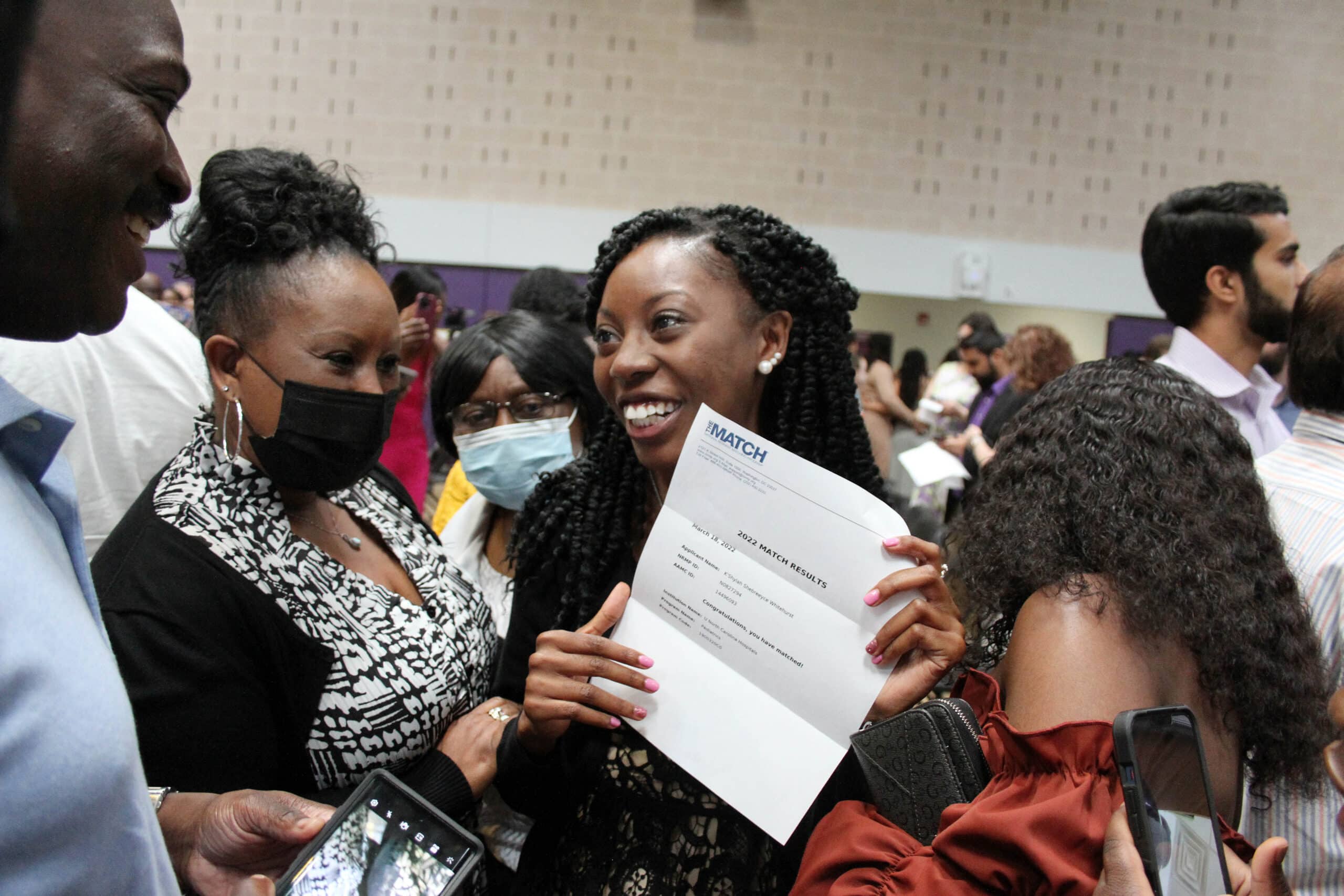 K’Shylah Whitehurst shows her match day letter to family members on Friday, March 18, 2022, at the East Carolina University’s Brody School of Medicine. Whitehurst matched with University of North Carolina Hospitals in Chapel Hill for pediatrics.