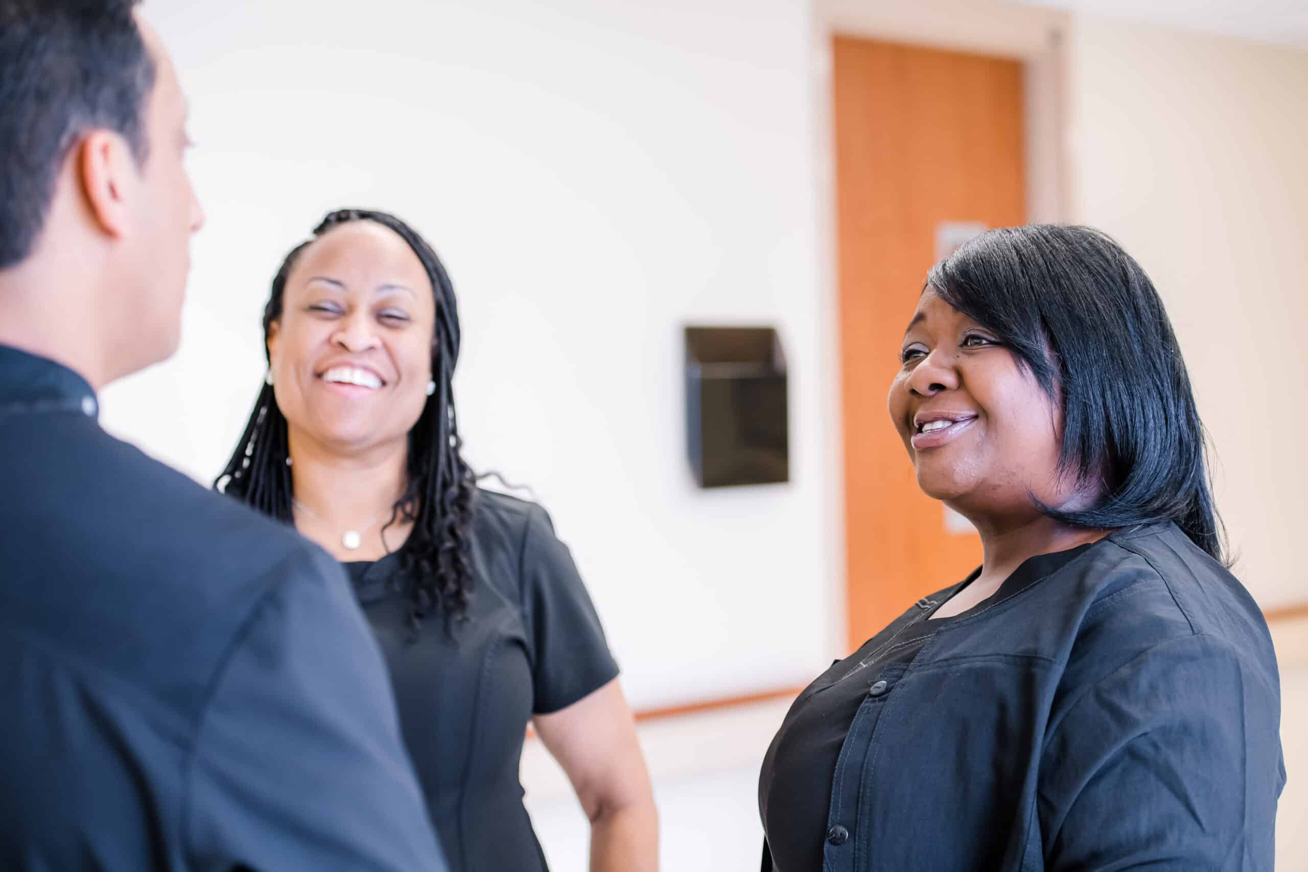 Tasha Dooley Photography 2019 ECU Health team members talk.