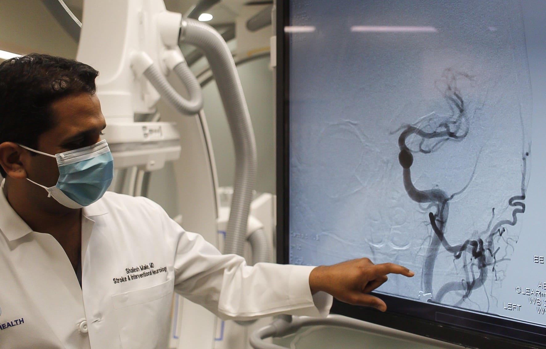 Dr. Male 1 Dr. Male observes a scan on a screen.
