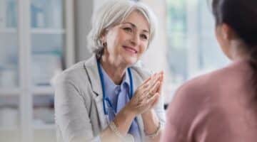 A health care provider speaks with a patient.