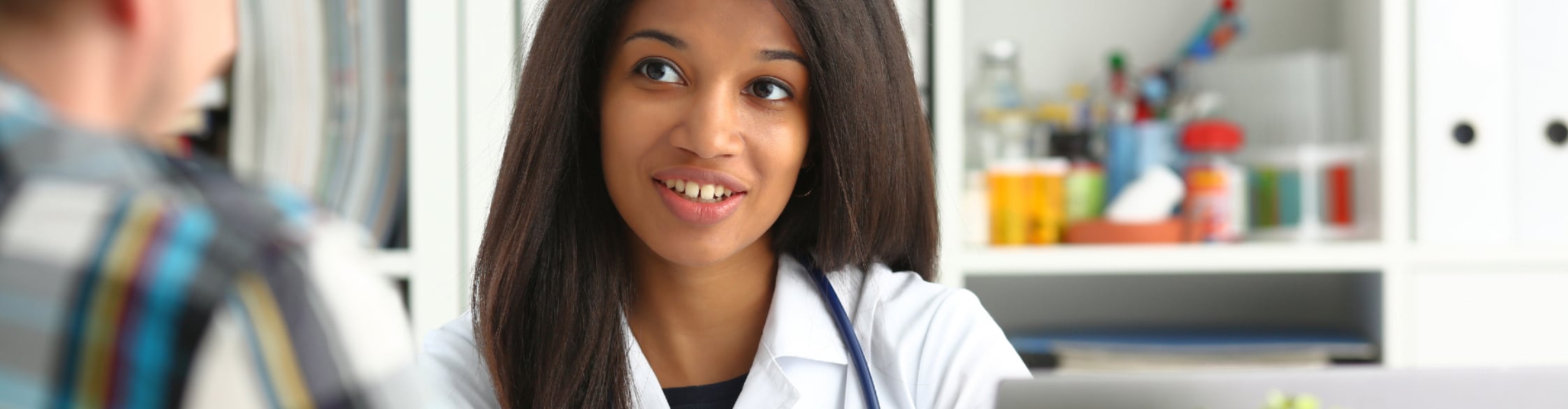 GettyImages-1050391674-586 A health care provider speaks with a patient.