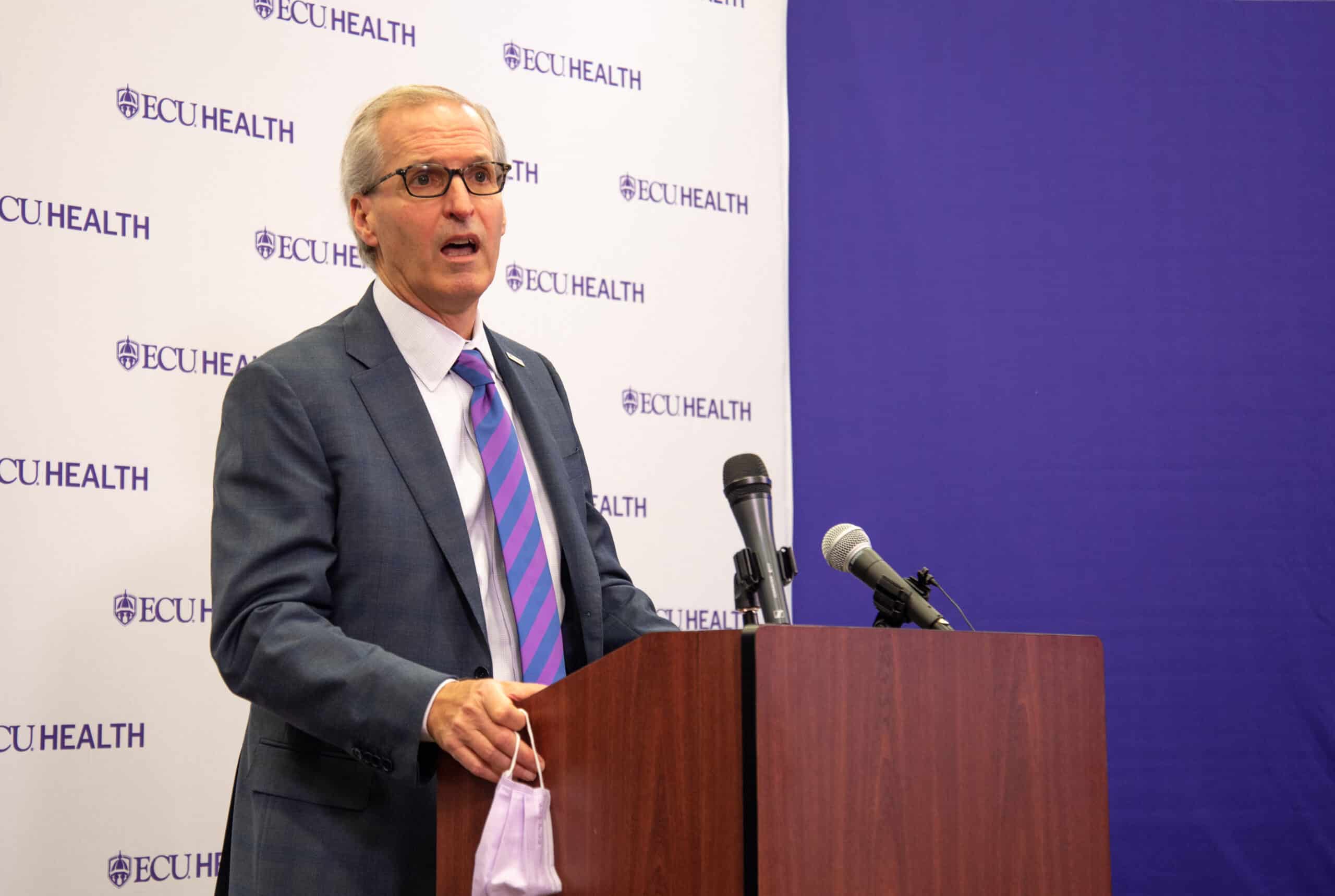 ECU Health CEO Dr. Michael Waldrum speaks during a press conference unveiling ECU Health's logo.