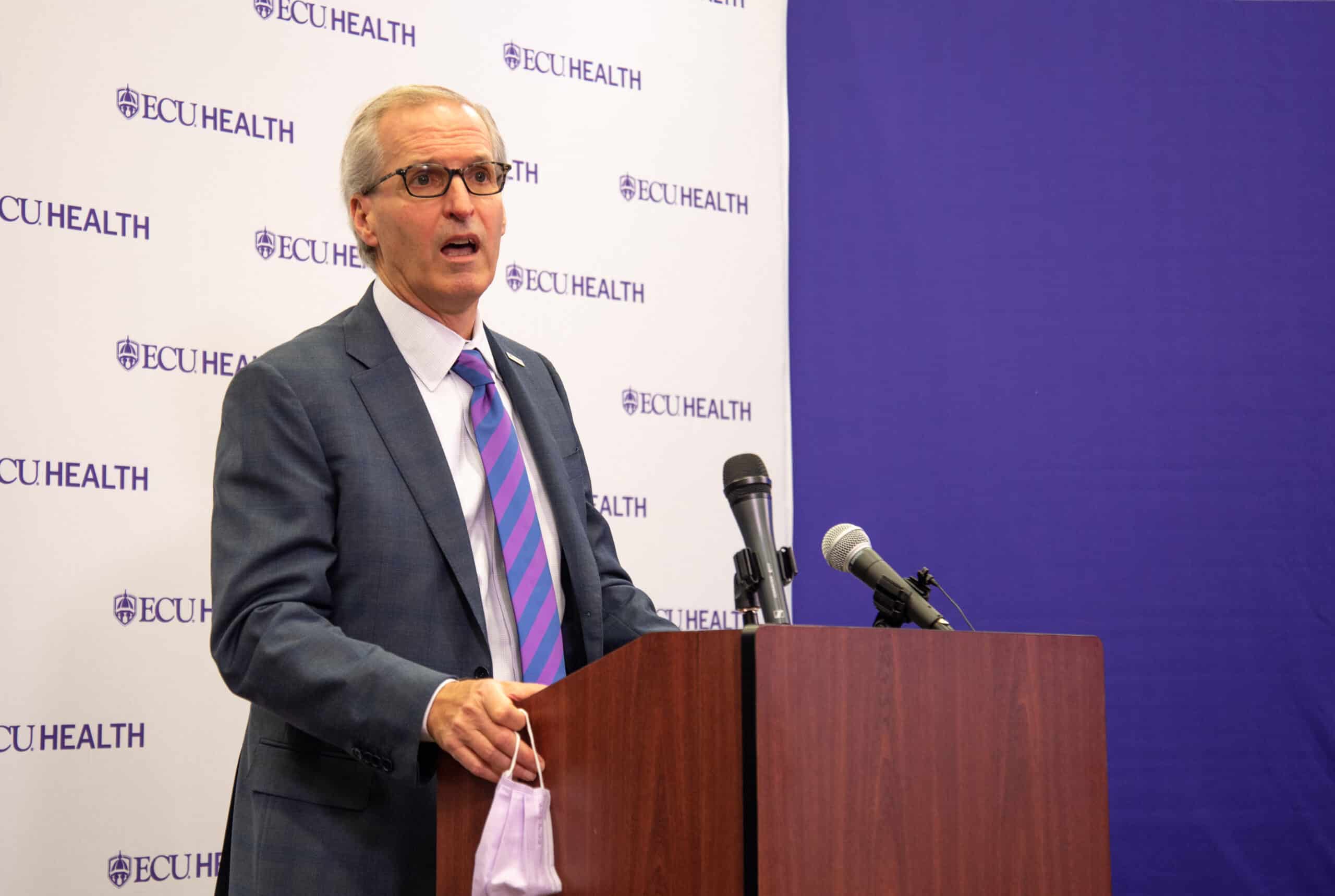 ECUH_Logo Press Conf-3816 ECU Health CEO Dr. Michael Waldrum speaks during a press conference unveiling ECU Health's logo.