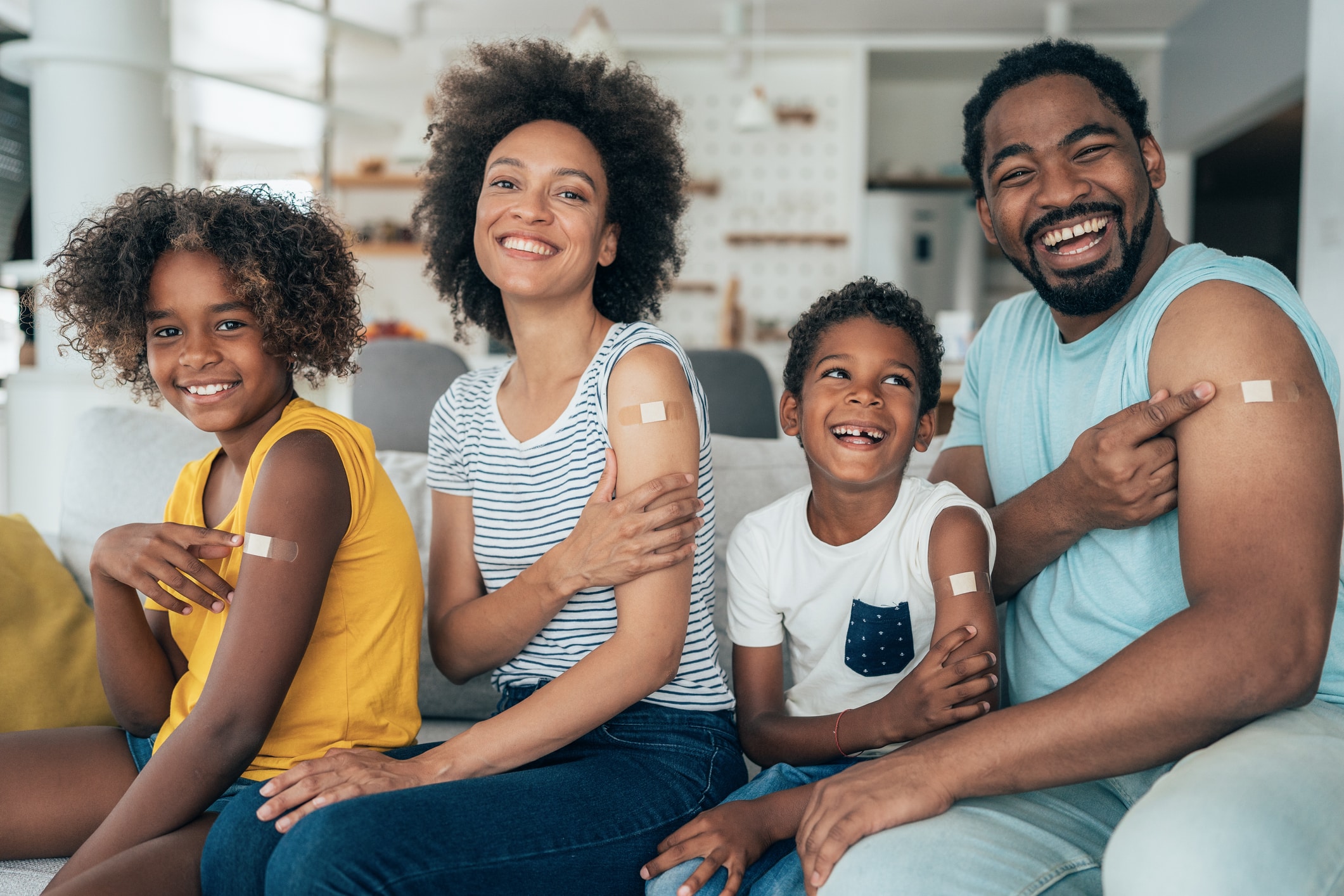 A family poses for a photo after receiving a COVID-19 vaccine.