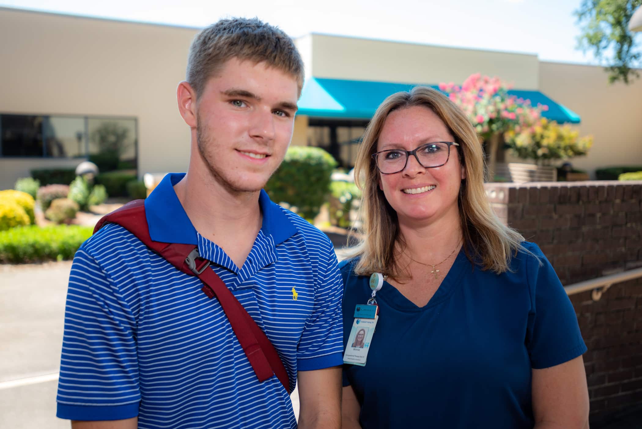 Occupational Therapy Assistant Winnie Miller poses for a photo with Taylor Anthony. They worked together over the last 14 years. Now, Taylor is heading off to college.