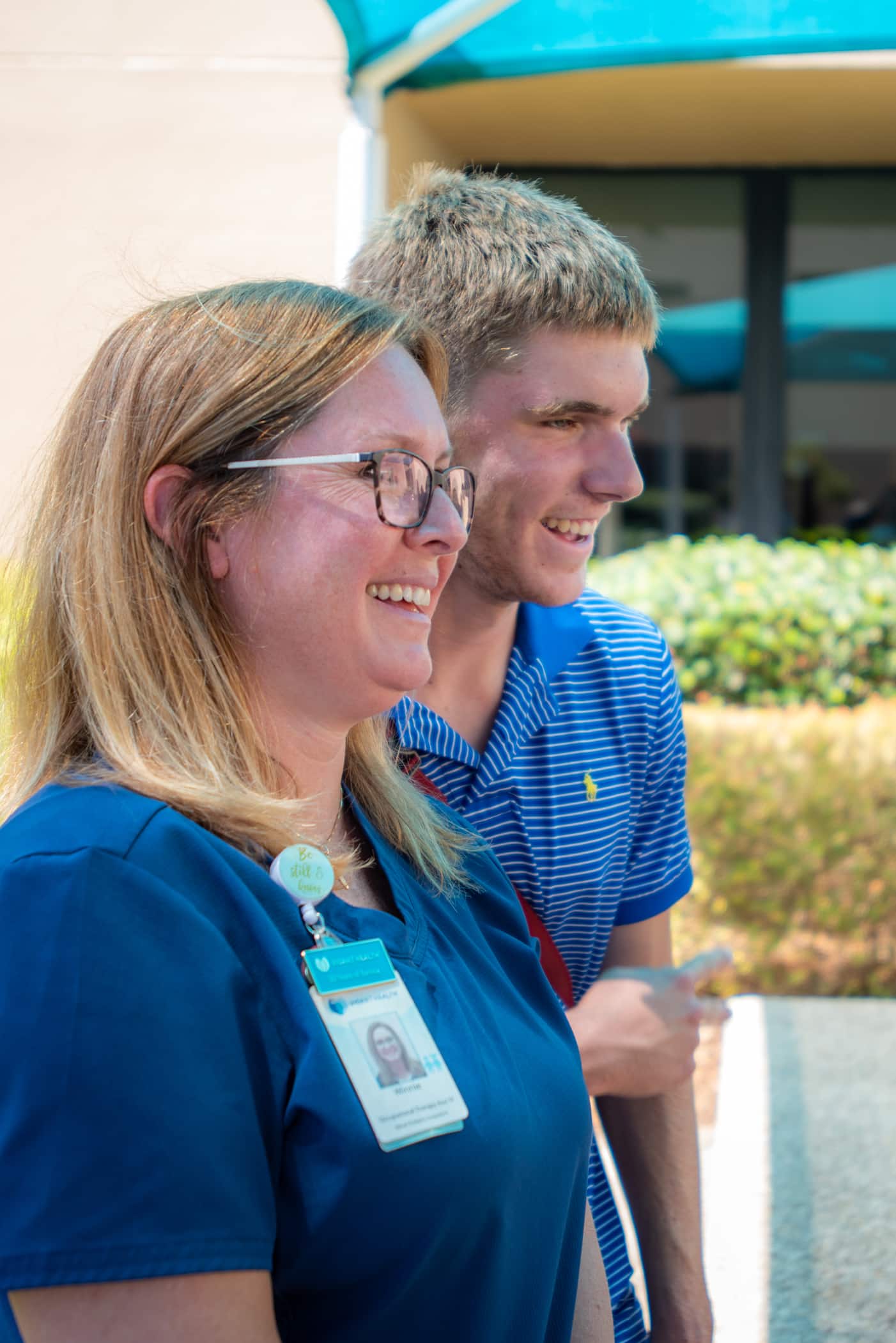 Occupational Therapy Assistant Winnie Miller stands with Taylor Anthony. They worked together over the last 14 years. Now, Taylor is heading off to college.