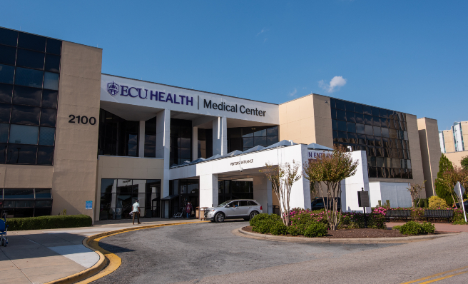 The main entrance of ECU Health Medical Center in Greenville is shown on a sunny day.