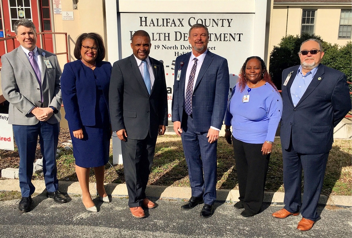 ECU Health leadership and government officials stand outside of the Halifax County Health Department.