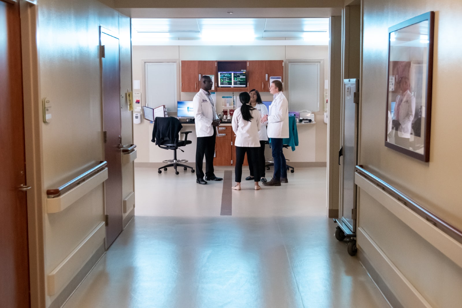 A team gathers to discuss patient care at the ECU Health heart center.