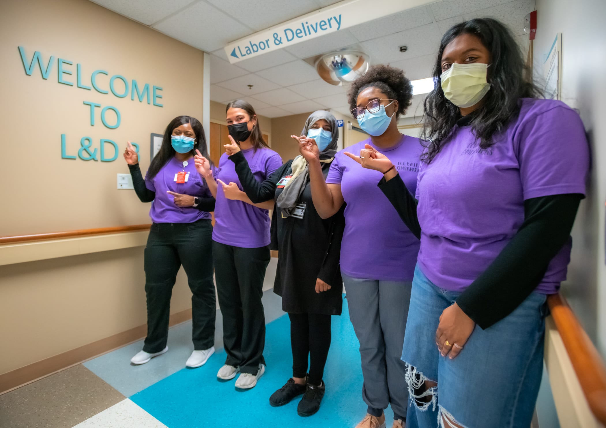 ECU Health birthing companions pose for a photo together at ECU Health Medical Center.