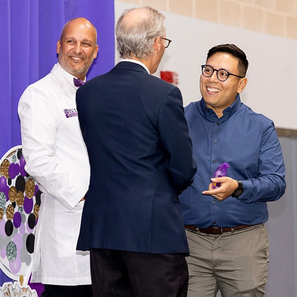 Inset4MatchDay A Brody School of Medicine student shakes hands with Brody Dean and ECU Health CEO Dr. Michael Waldrum during Match Day 2023.
