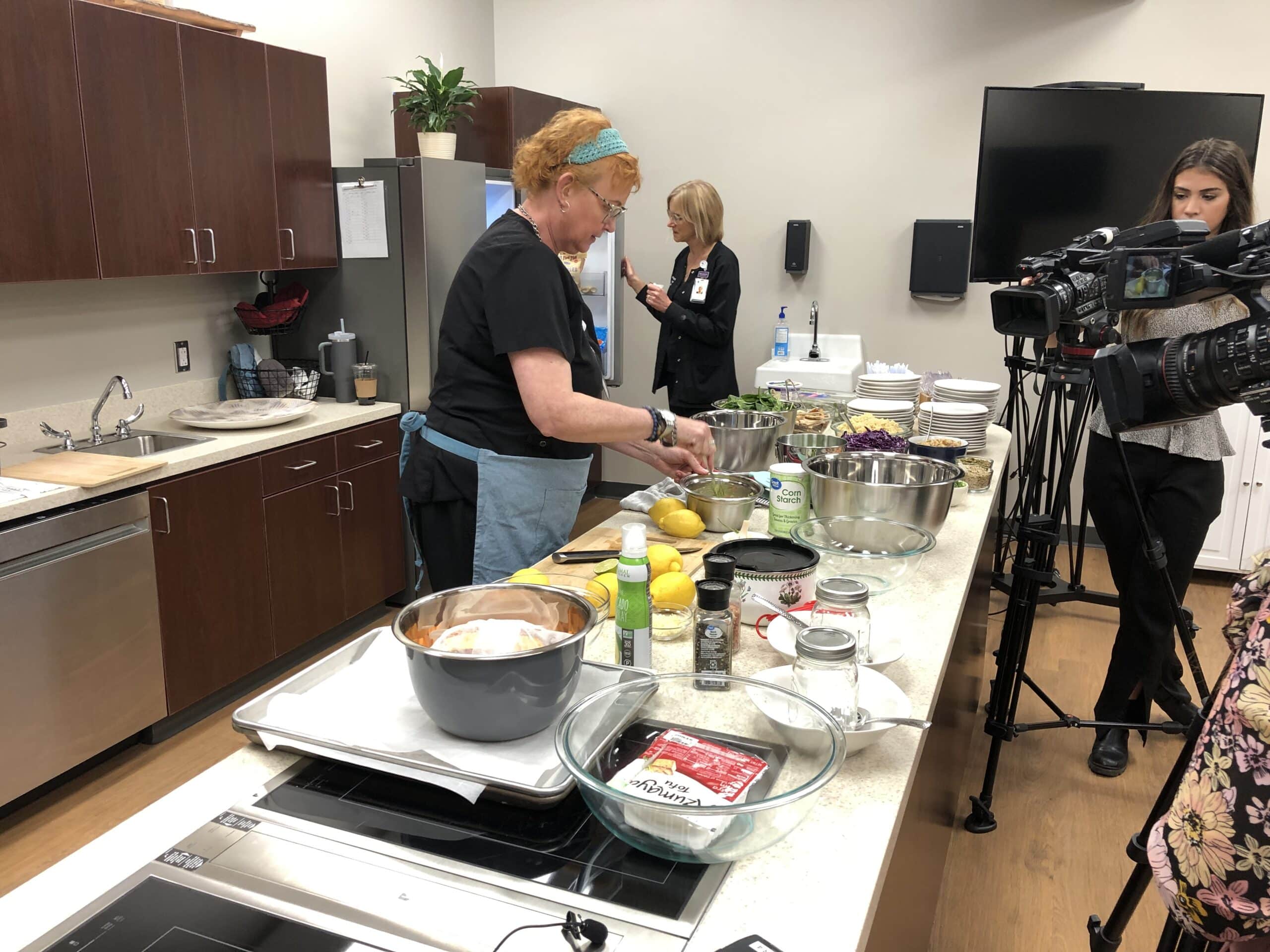 Susie Houston prepares a meal during a Lunch with a Doc event at ECU Health's Lifestyle Medicine Clinic in Greenville.