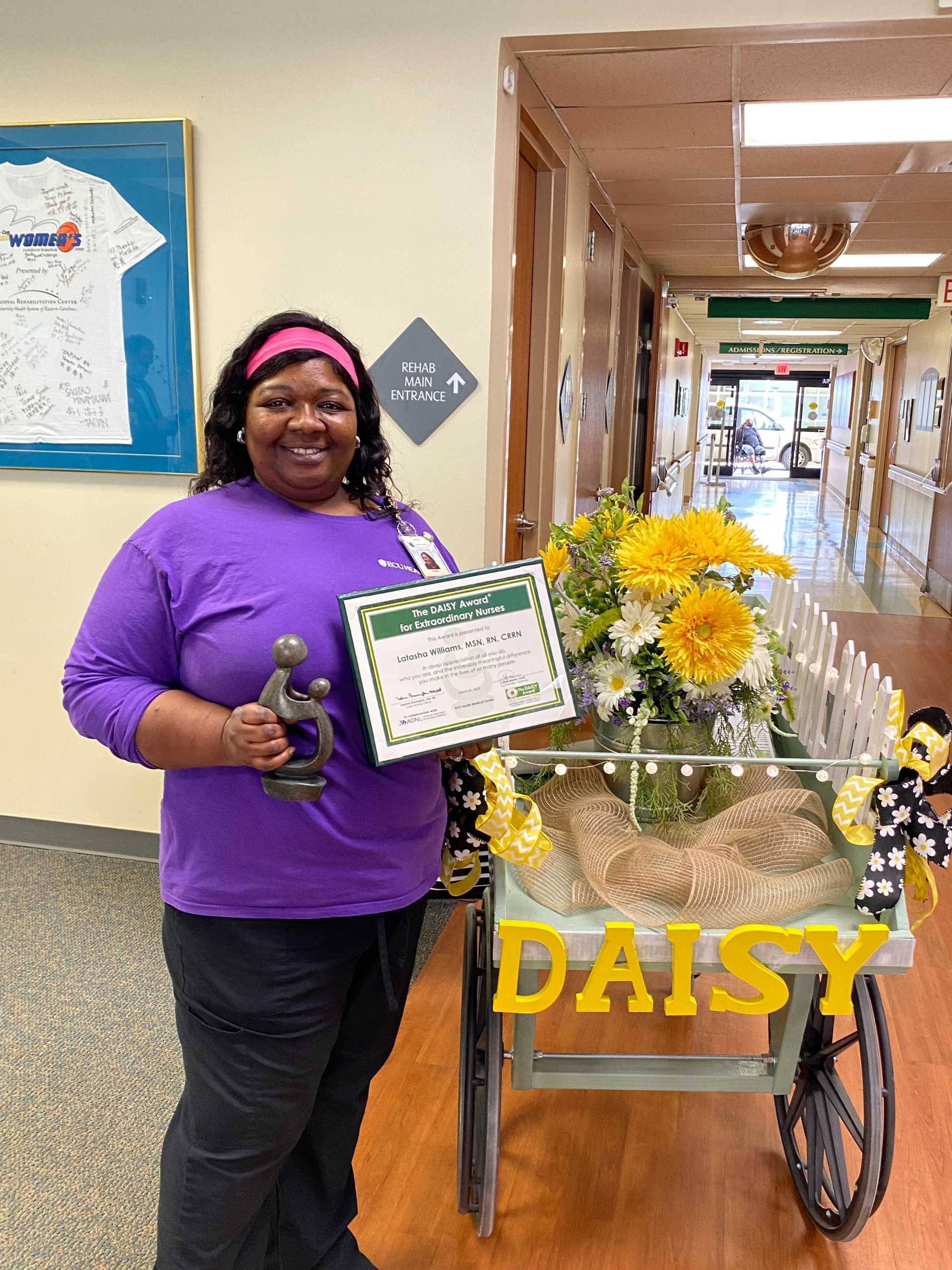 Latasha Williams 1920x2560 Latasha Williams poses for a photo as she receives the Daisy Award.