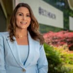 ECU Health Chief Nursing Executive Trish Baise poses for a photo outside of the ECU Health Administration Building.