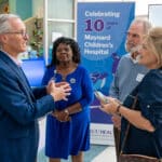 ECU Health CEO Dr. Michael Waldrum speaks with attendees at the 10th anniversary celebration for Maynard Children's Hospital at ECU Health Medical Center.