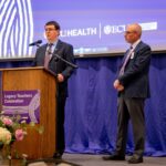 LegacyTeachersEvent-2023-4515 ECU Health Chief Operating Officer and President of ECU Health Medical Center Brian Floyd stands on stage during the ECU Health and Brody School of Medicine Legacy Teachers event.