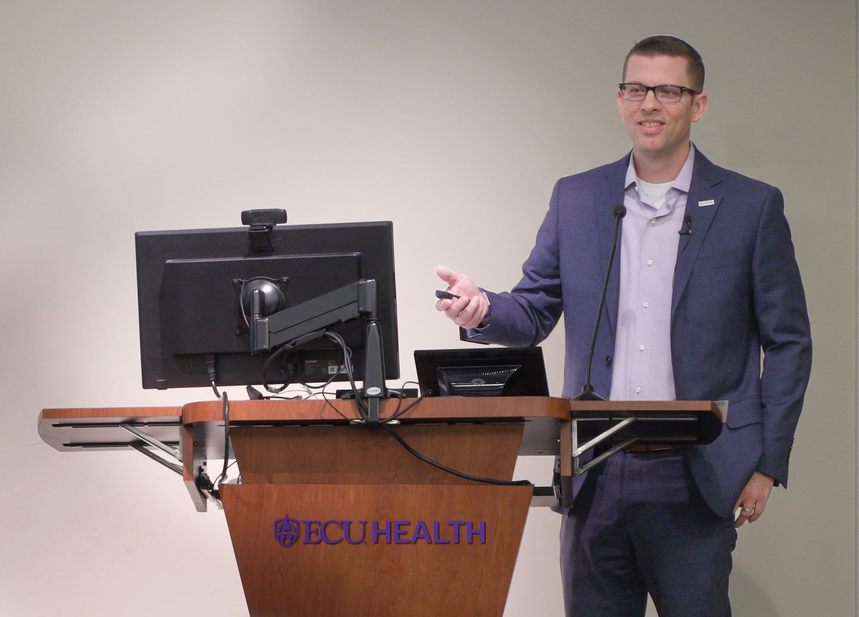 ECU Health CFO Andy Zukowski speaks to ECU Health team members during a presentation.