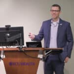 ECU Health CFO Andy Zukowski speaks to ECU Health team members during a presentation.