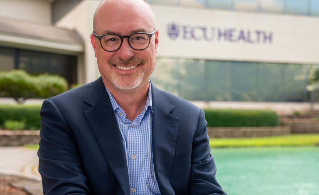 ECU Health Chief Operating Officer and President of ECU Health Medical Center Brian Floyd poses for a photo outside of ECU Health's Administration Building.