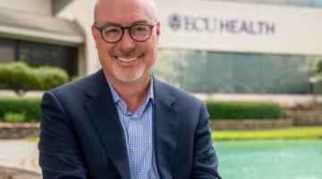 ECU Health Chief Operating Officer and President of ECU Health Medical Center Brian Floyd poses for a photo outside of ECU Health's Administration Building.